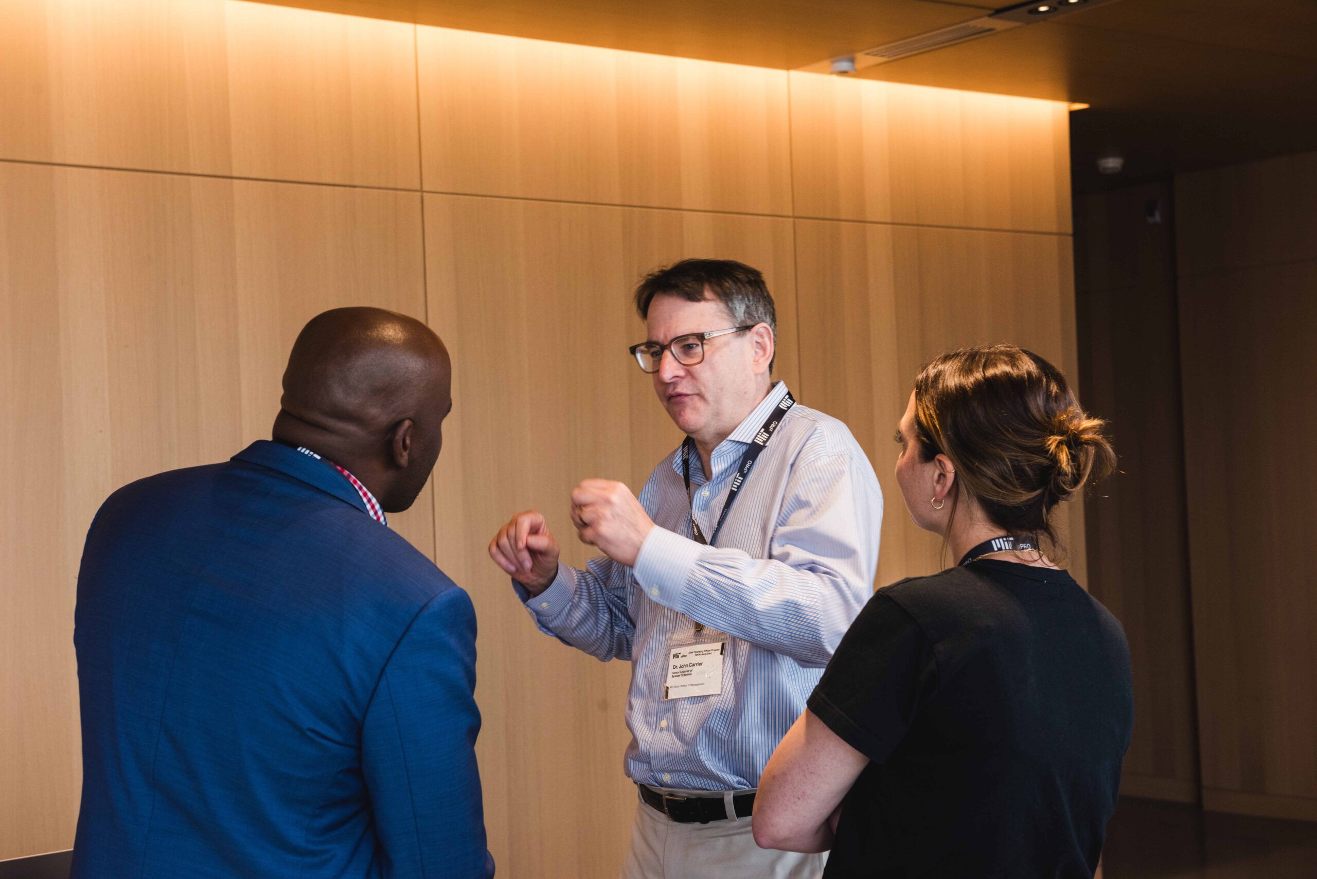 Faculty director David Niño in conversation with participants during a networking event